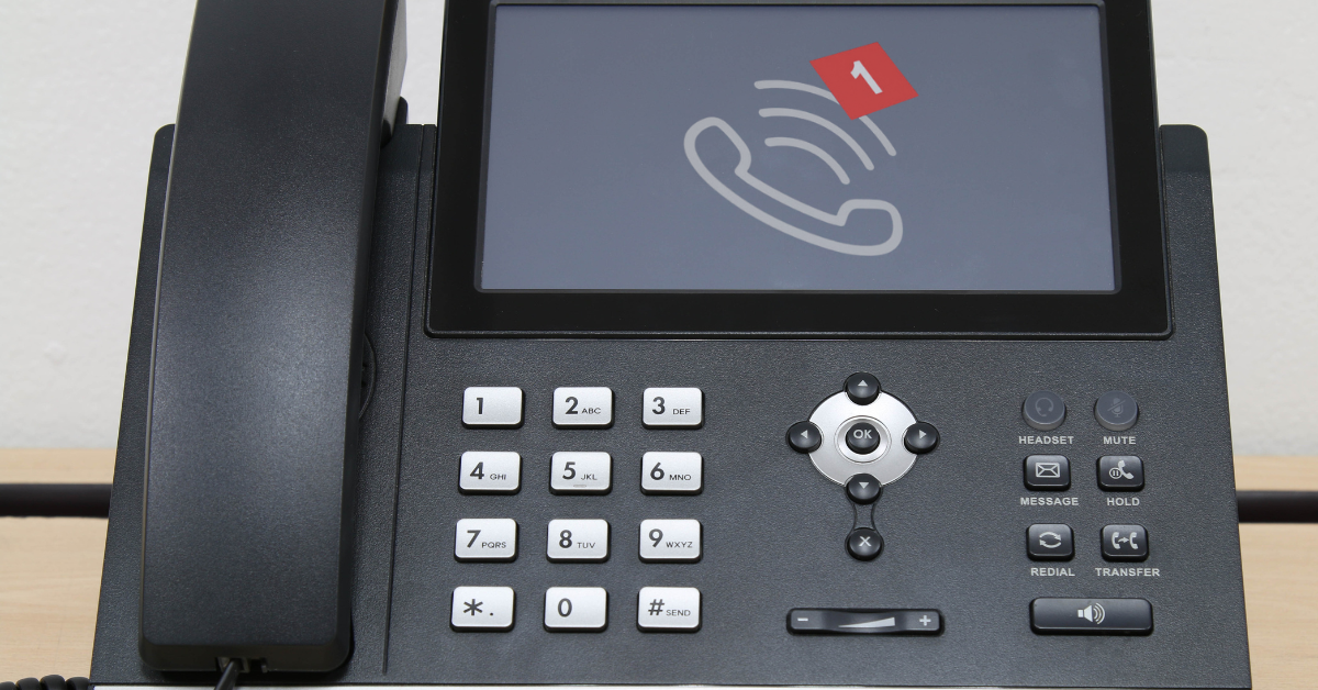 Desk phone with ringing phone icon and one red missed call alert next to it.