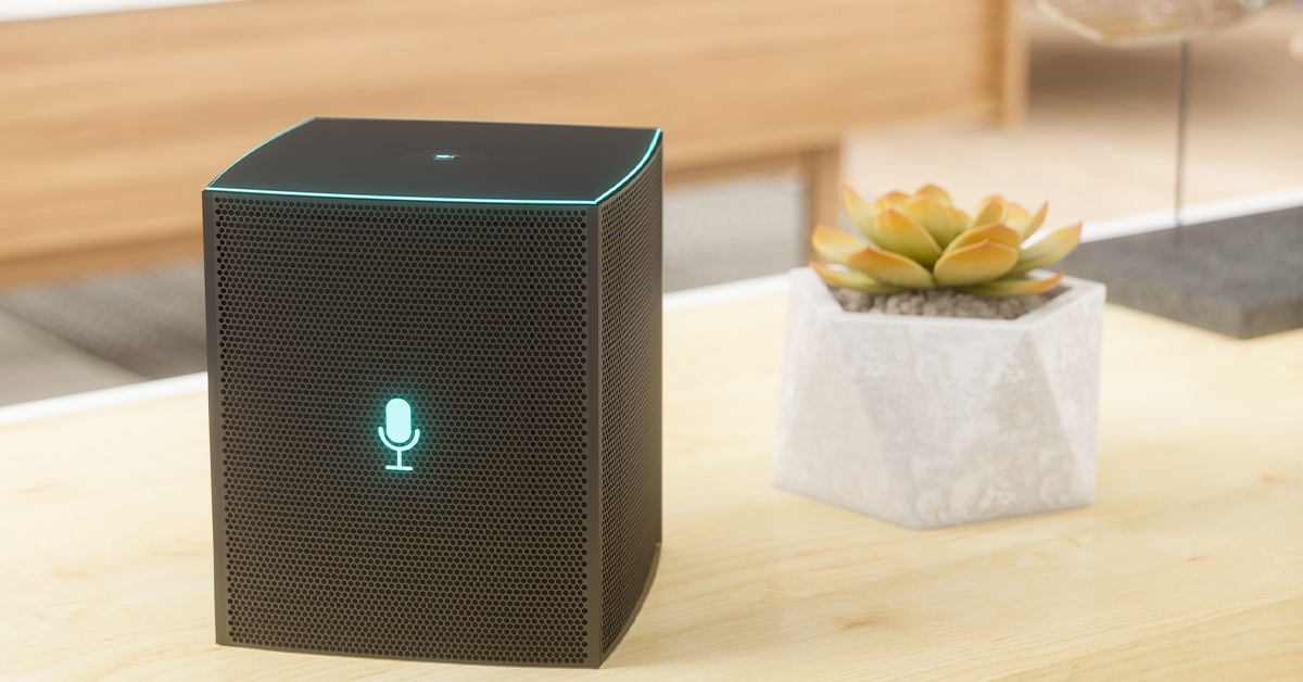 A speaker and a plant on a table in a waiting room