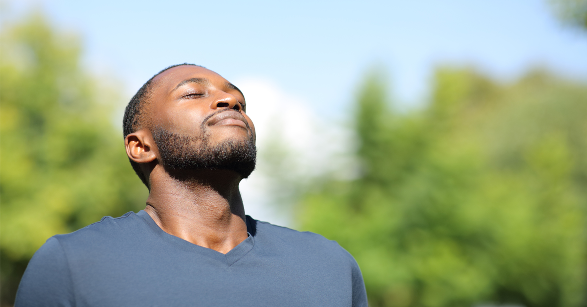 a man takes a deep breath from the diaphragm to help steady his nerves