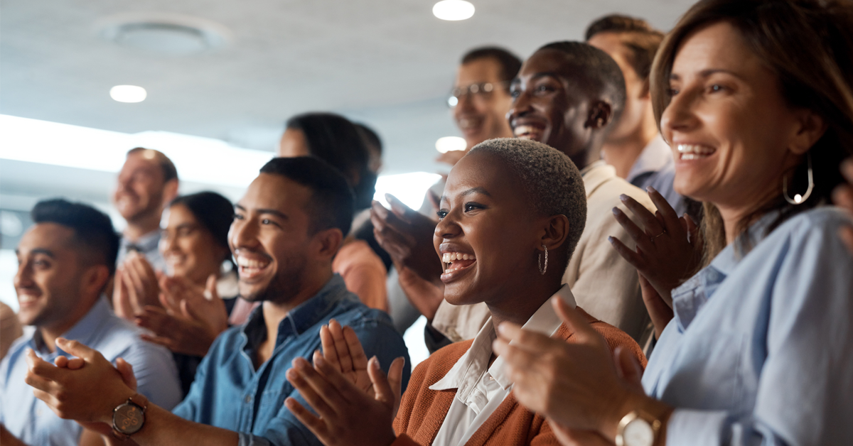 dental teammates cheer at an industry conference panel