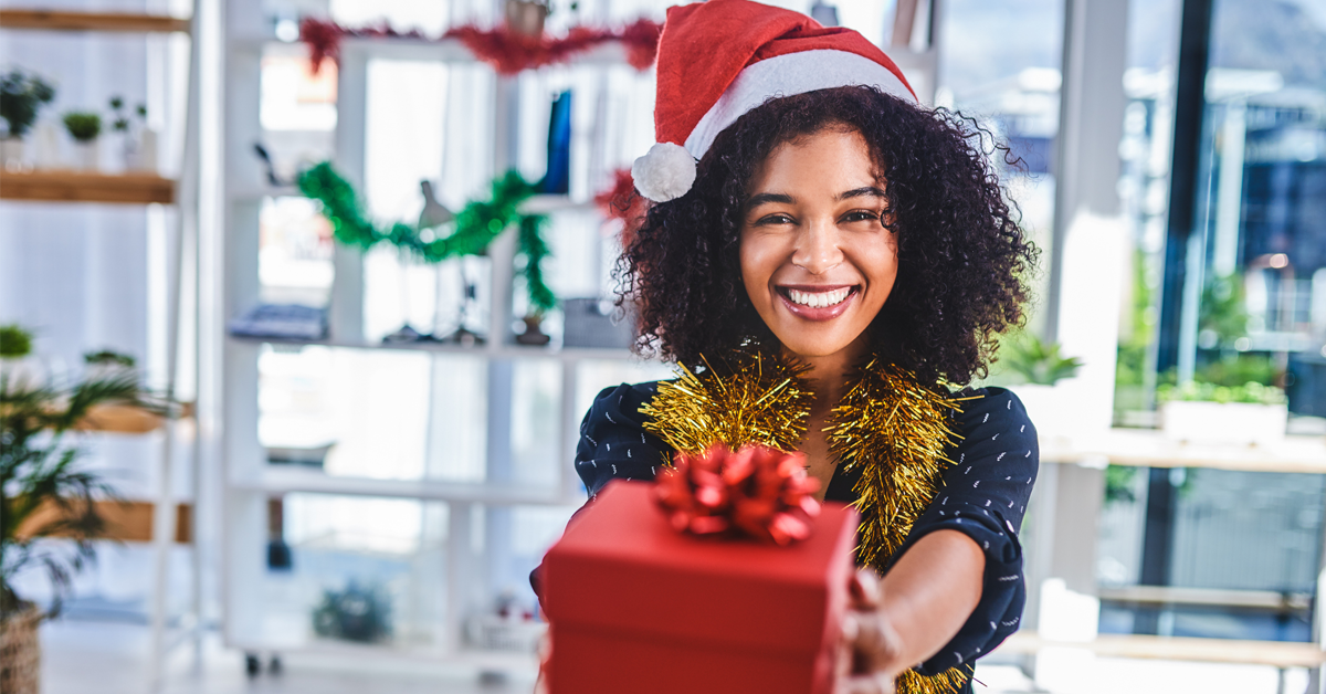 a dental team member receives a personalized holiday gift 