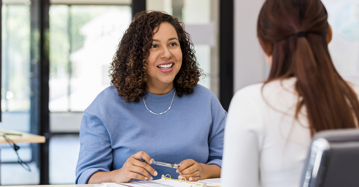 a woman gives a performance review at the dentist's office