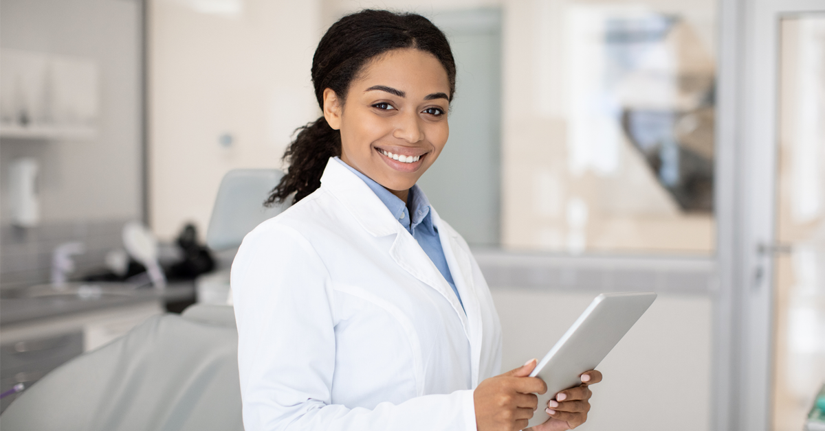 a dental teammate grins because she is shown gratitude at her office